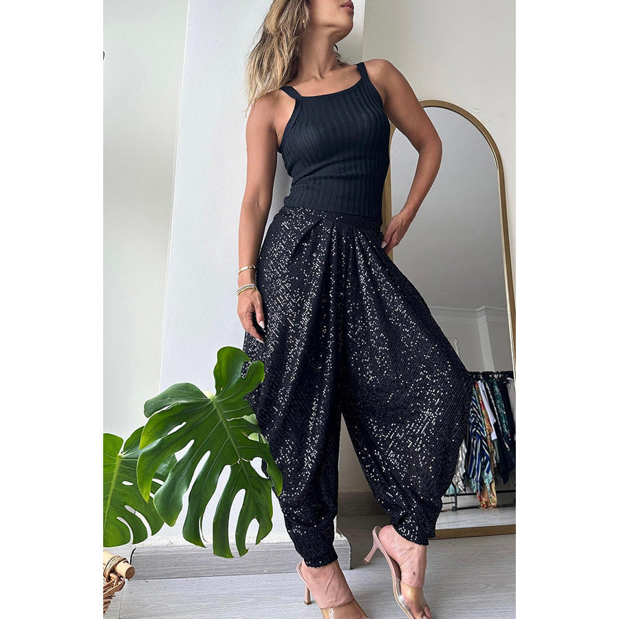 Pantaloni larghi con elastico in vita e paillettes