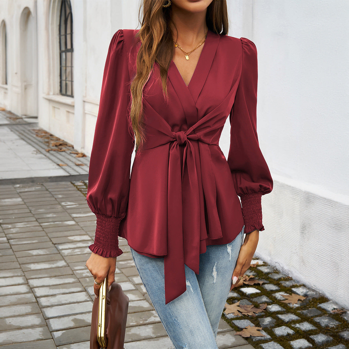 Blusa de manga larga con escote en V y color liso