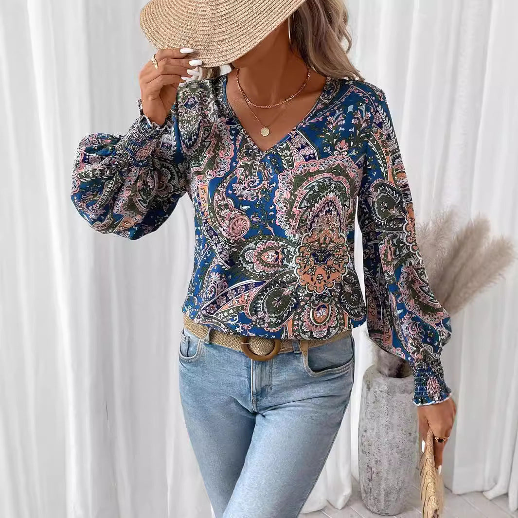 Camisa elegante con cuello en V y mangas farol estampadas