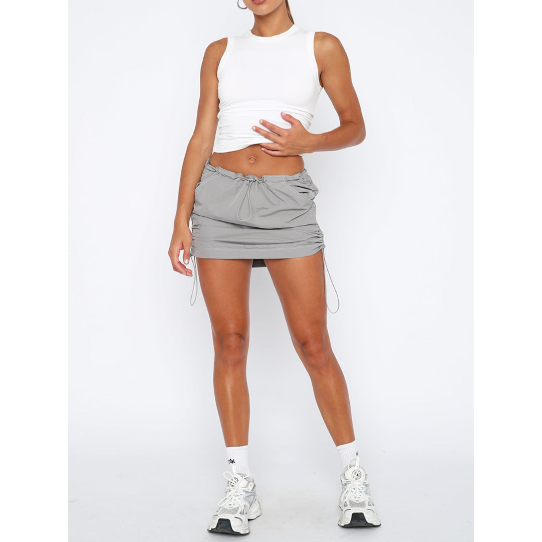 Falda de bolsillo casual deportiva con cierre de resorte y banda de goma plisada de color sólido