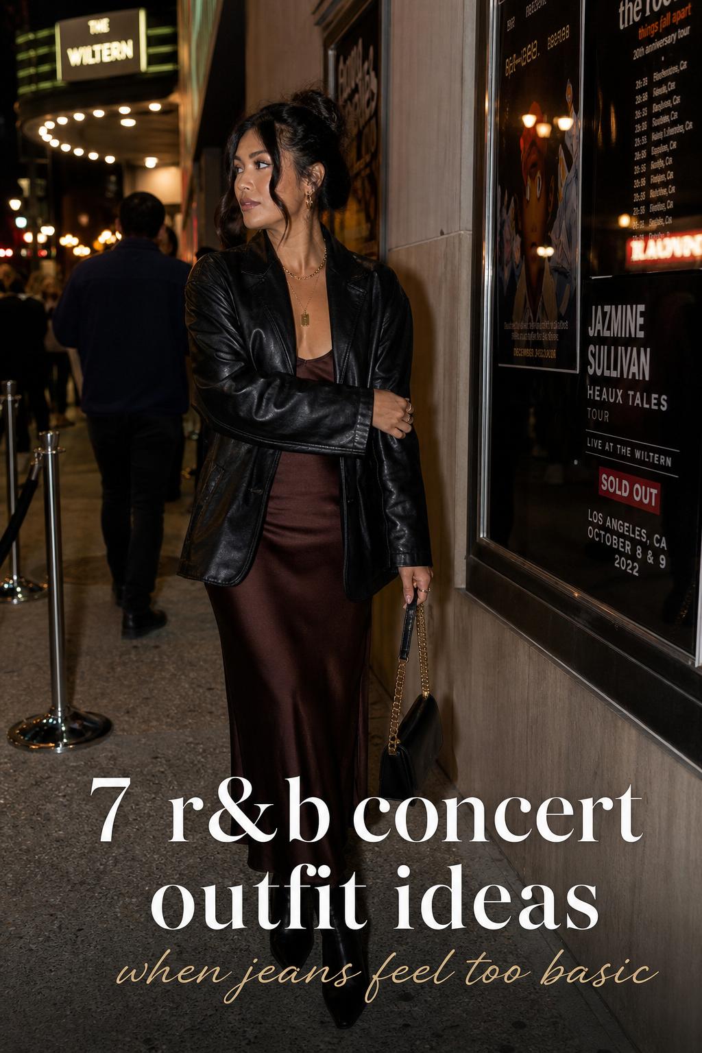 r&b concert outfit ideas with a woman in satin midi dress and leather jacket outside a live music venue at dusk