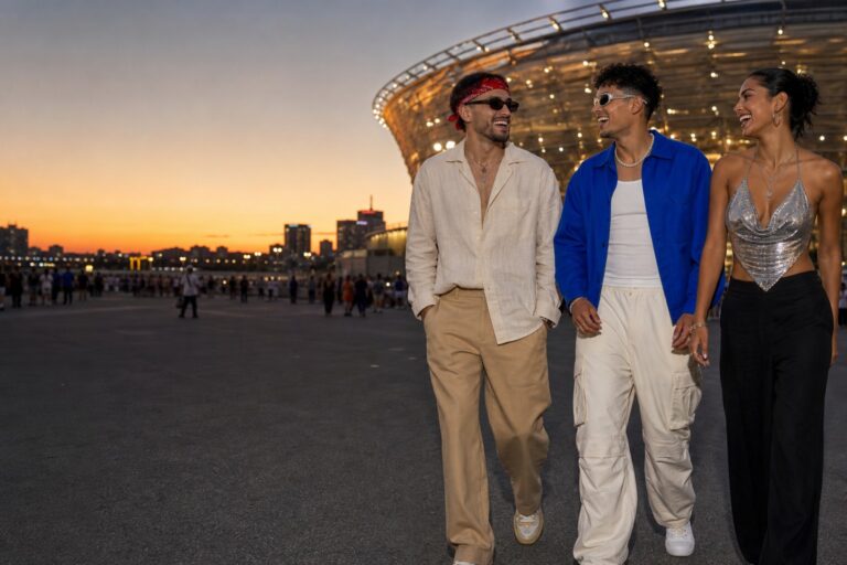 Bad Bunny concert outfit ideas with neutral, cobalt, and metallic looks outside a stadium