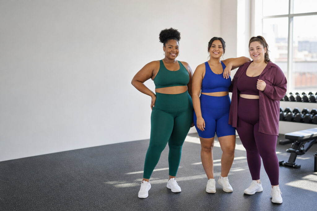 plus size gym outfits with three diverse women in coordinated activewear