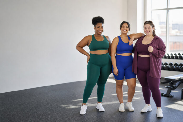 plus size gym outfits with three diverse women in coordinated activewear