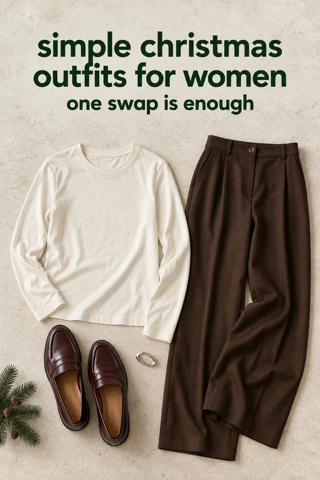 simple christmas outfits for women flatlay with ivory tee, brown trousers, burgundy loafers, and brooch