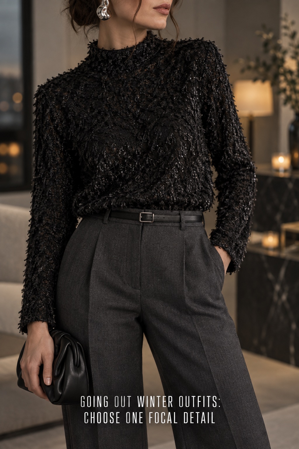 going out winter outfits close-up of a textured top, trousers and sculptural earring