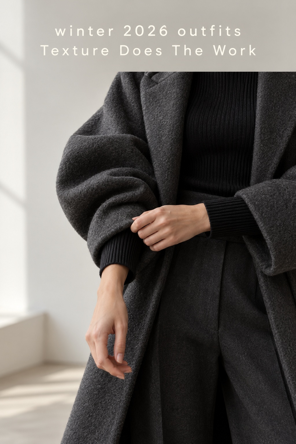 winter 2026 outfits close-up of a charcoal wool coat and ribbed knit cuff
