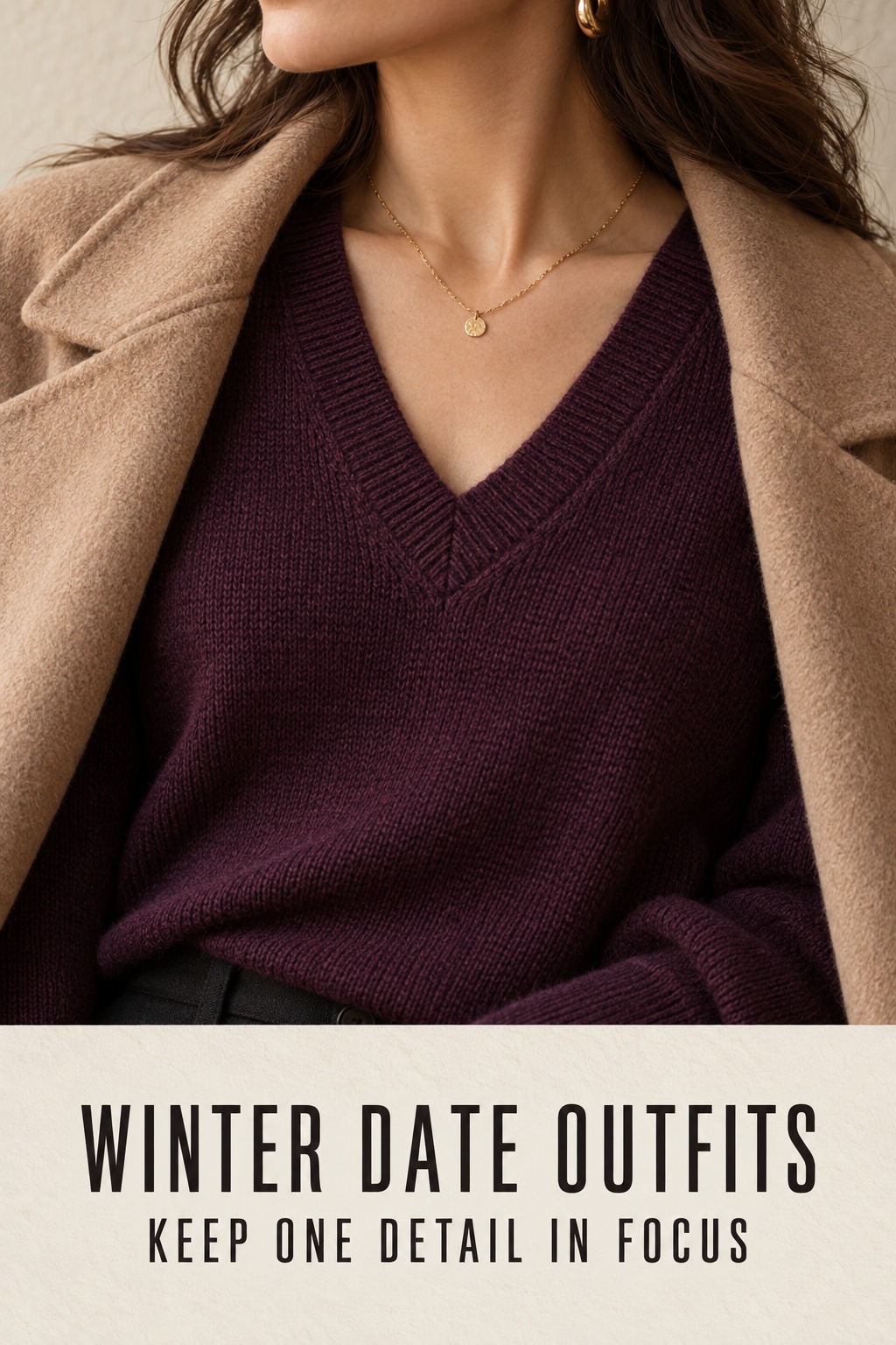 winter date outfits close-up of a plum V-neck knit, camel coat lapel, and gold necklace